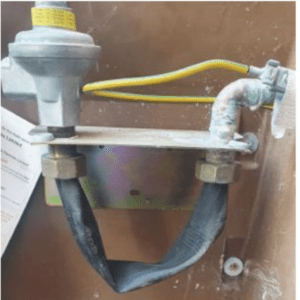 Gas meter that has been bridged with rubber tubing