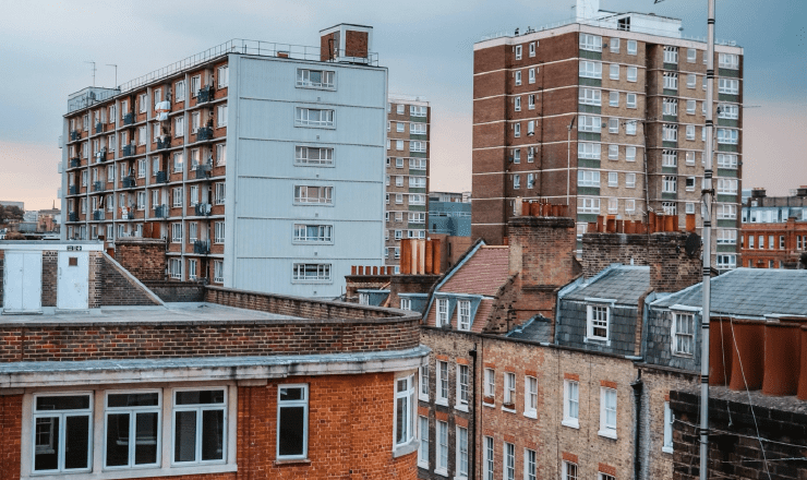 Rooflines of different types of home in London, showing apartments and brick houses