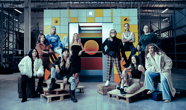 10 women trades professionals posing in a set built by women and girls. Photographed by Sane Seven for B&Q's campaign to celebrate women in trades