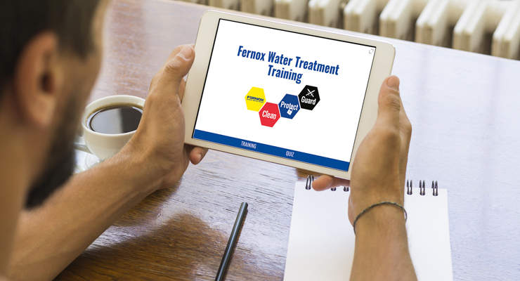 Someone accessing Fernox Water Treatment Training from their tablet