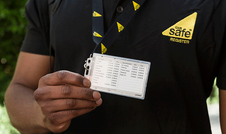 Gas engineer showing his Gas Safe ID card