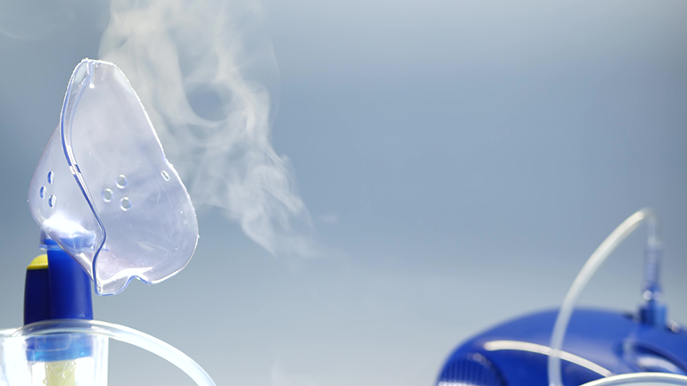 Close up image of a medical nebuliser mask with oxygen escaping from it